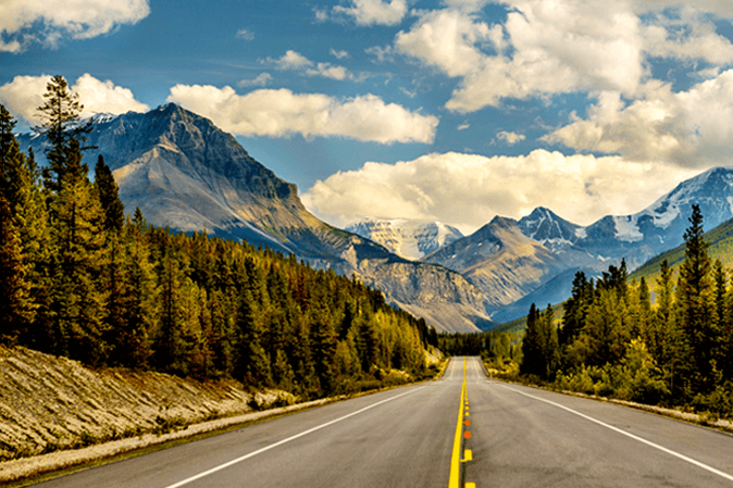 Long highway going towards the Colorado Rockies