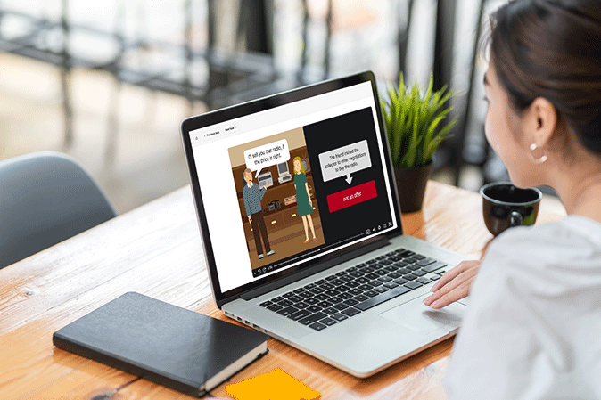 Young woman watching a Quimbee SideBar video on her laptop