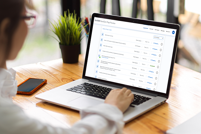 Young woman typing on a laptop with NextGen Prep Preview