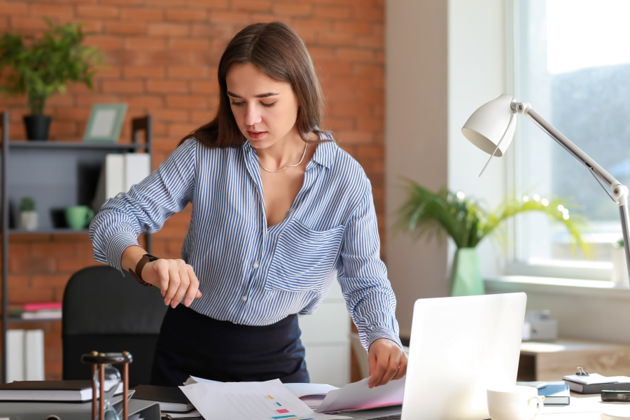 Photo of female lawyer looking at her watch