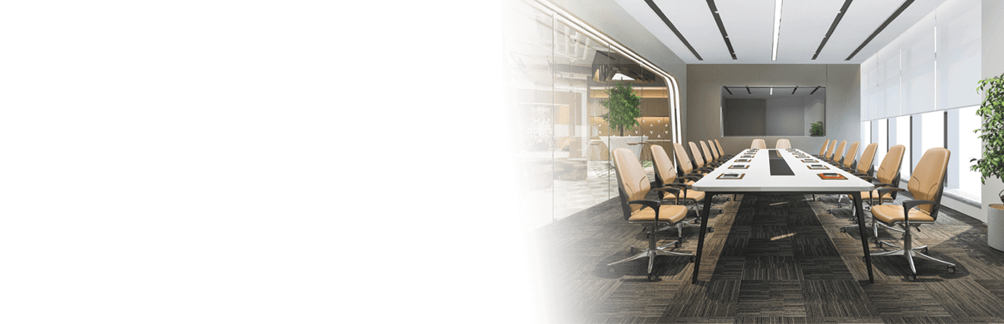 Image of meeting room with a long table, tan chairs, a large TV screen, and big windows.