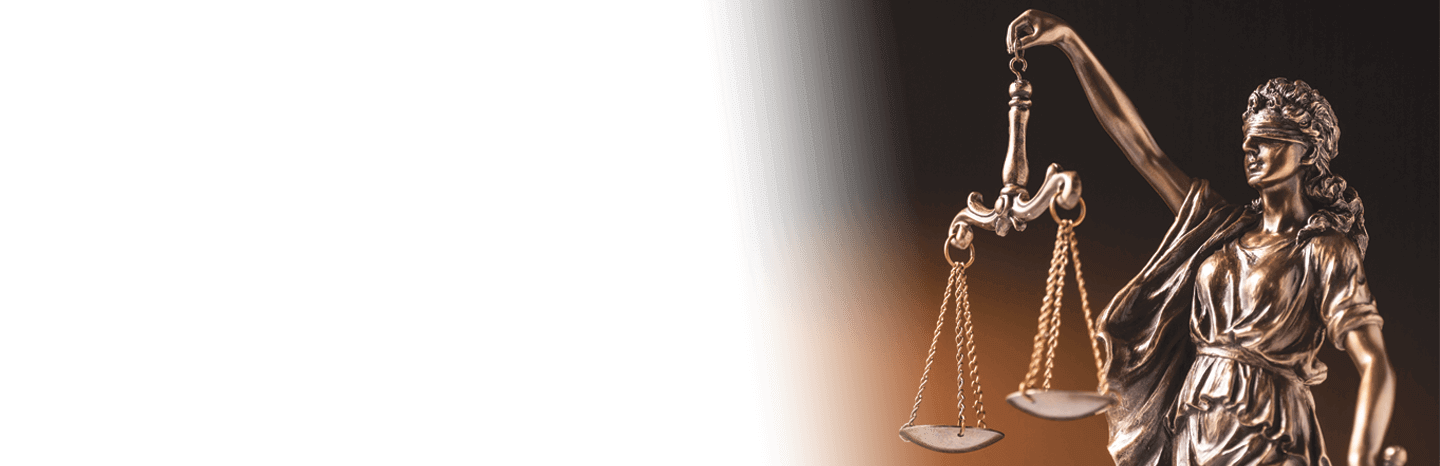 Bronze statue of Lady Justice holding scales