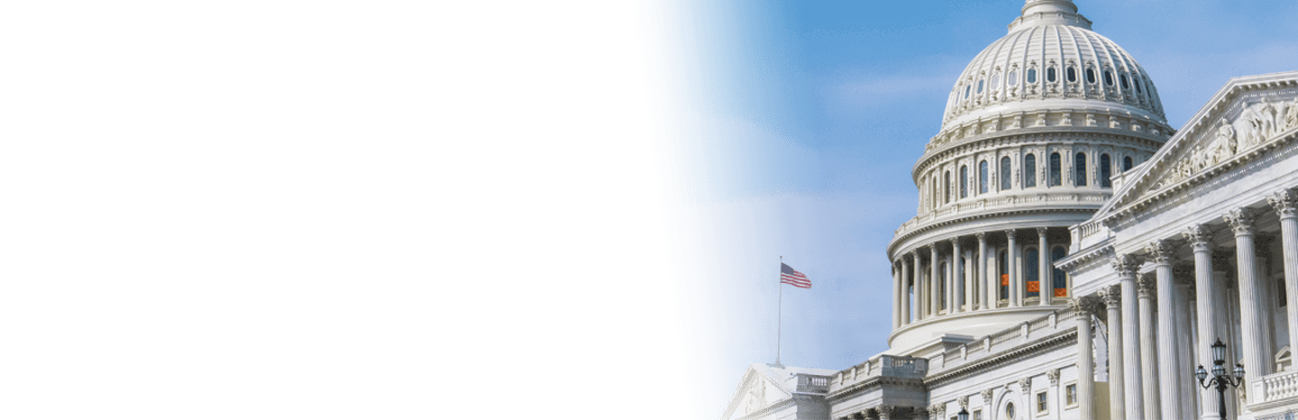 United States Capitol building with an American flag in the foreground