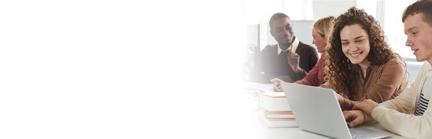 Pairs of students working together in class on computers