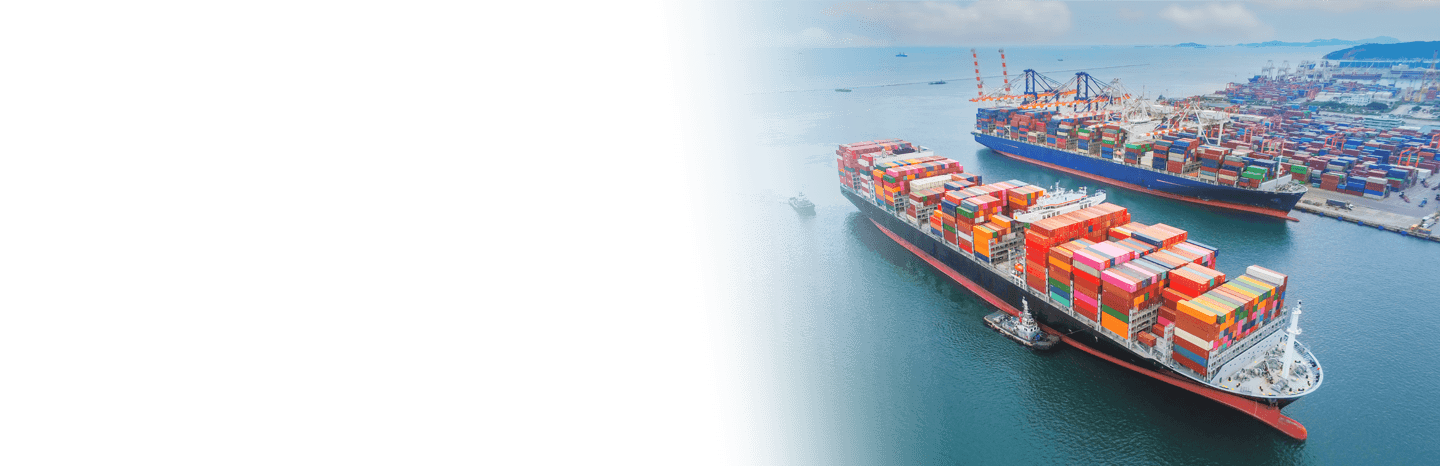 Cargo ships traveling through a channel in a port