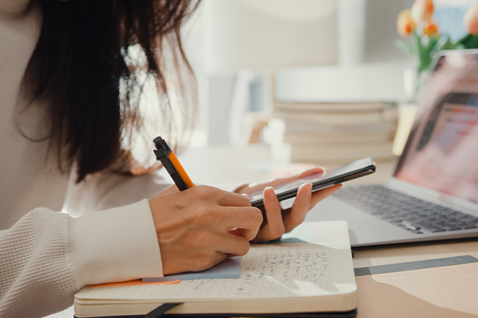 student taking notes in her diary