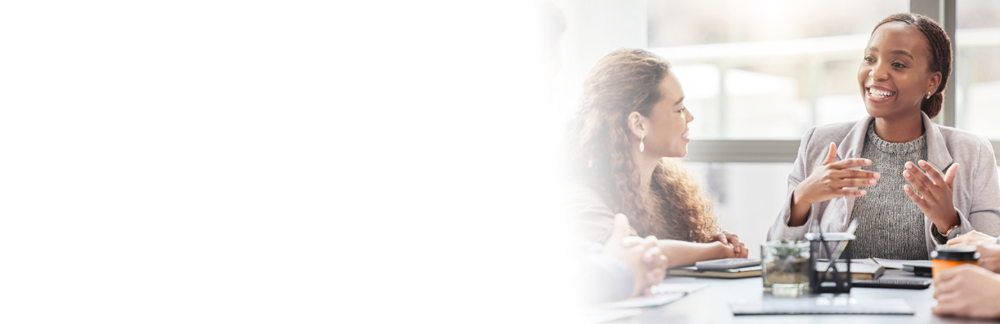 Young woman talking to her coworkers in a meeting